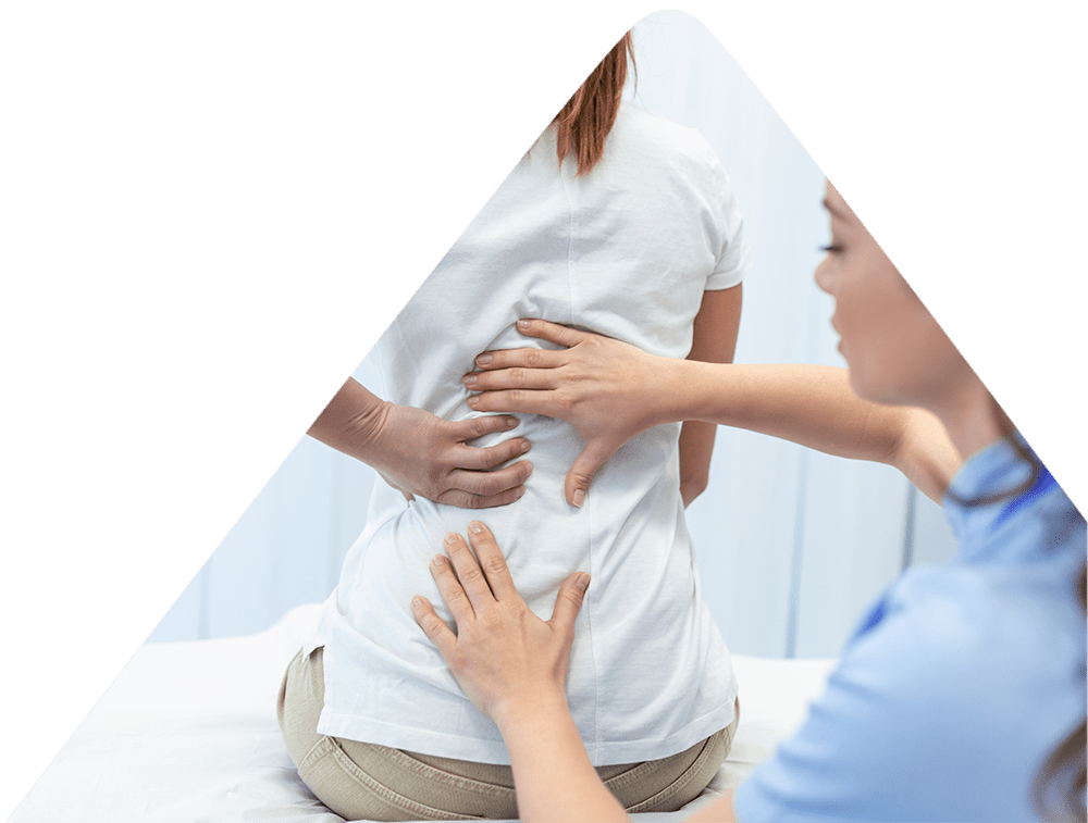 VIew from the back of patient with hands on her back and chiropractor tapping her spine.